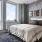 a bedroom with a large window