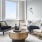 a living room with a couch and a round coffee table