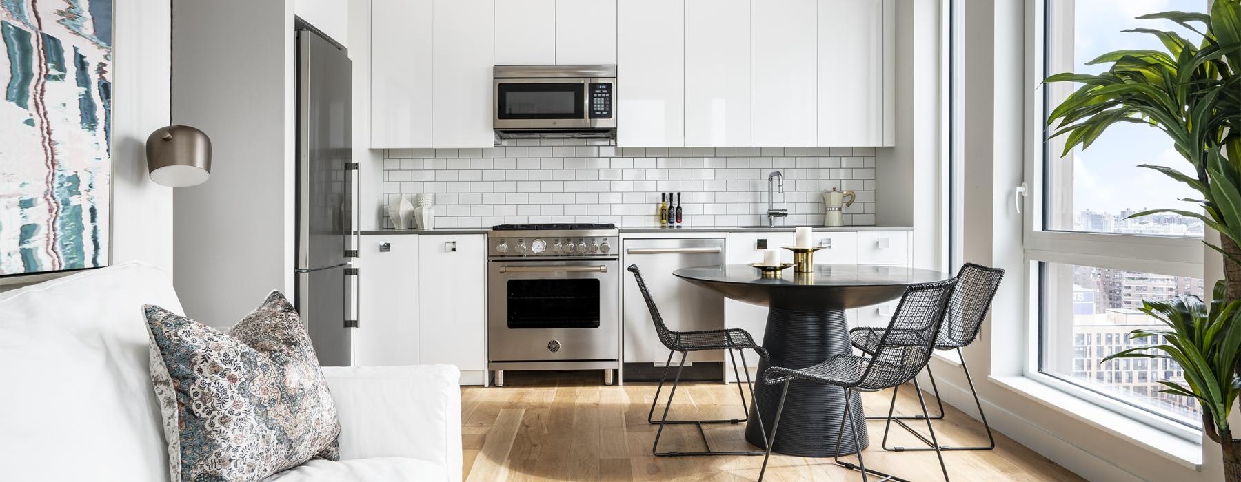 a kitchen with white cabinets