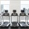 a group of treadmills in a room with a window