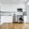 a kitchen with white cabinets