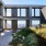 a building with a walkway and grass