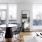 a living room with a table and chairs